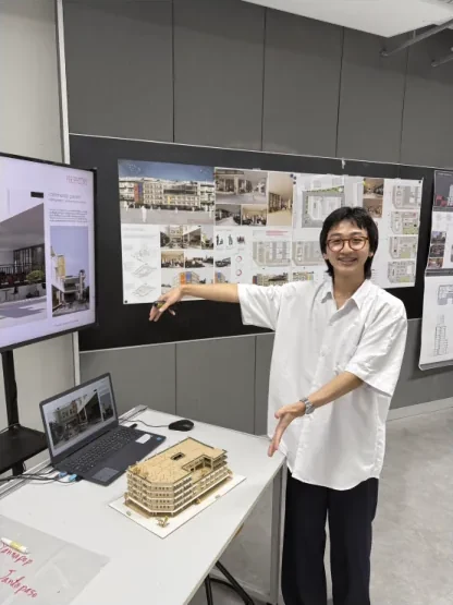 Oak presenting his architecture project models and boards